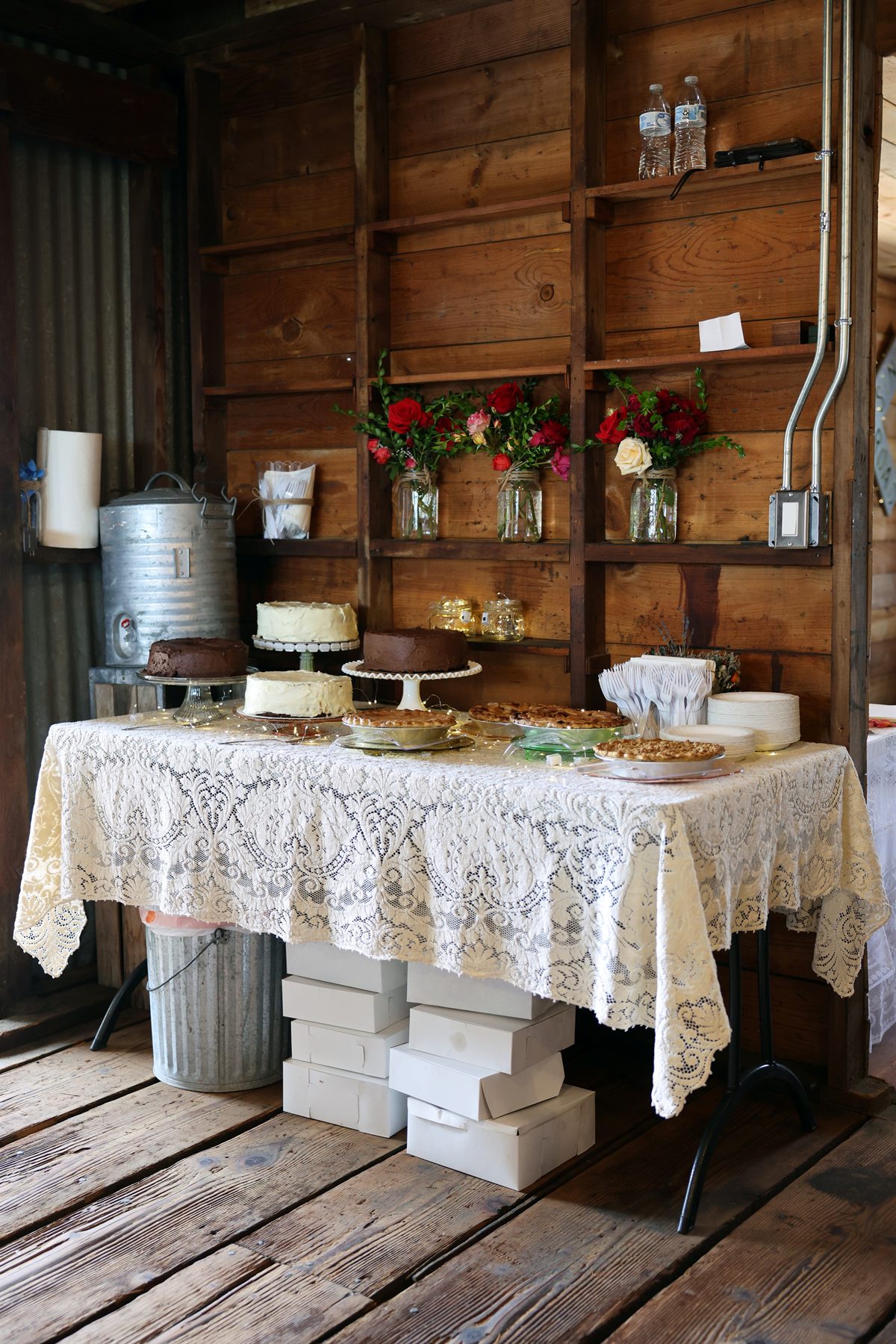 Dessert table and floral wall in the restored venue.