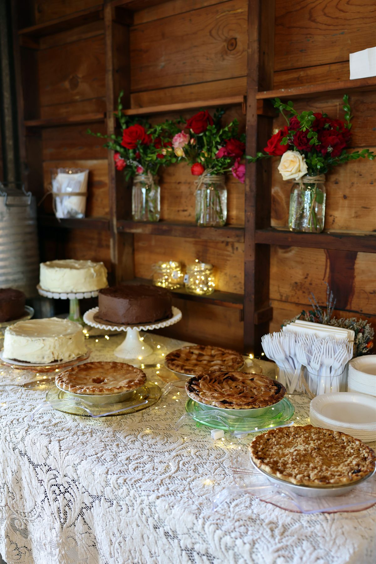 Cakes and pies against restored wood walls.